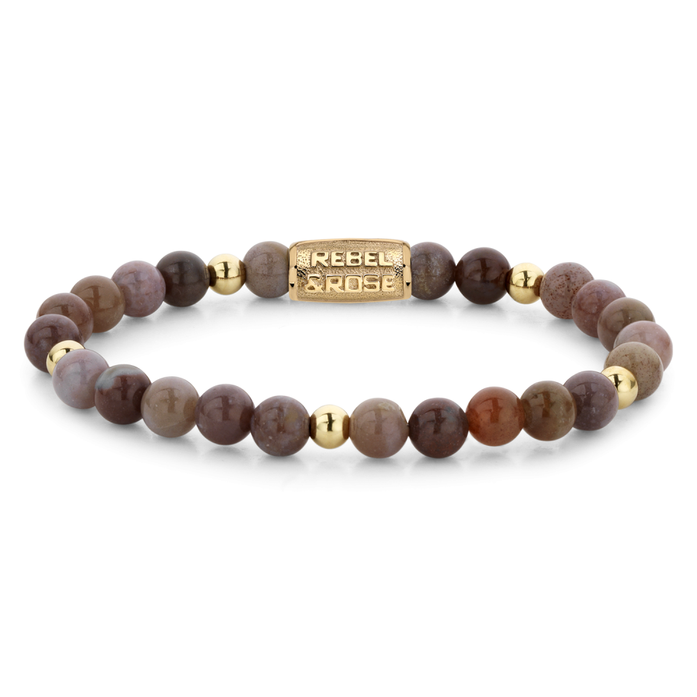 Deze armband is van het merk Rebel & Rose. Het is een damessieraad. De armband is goud van kleur.