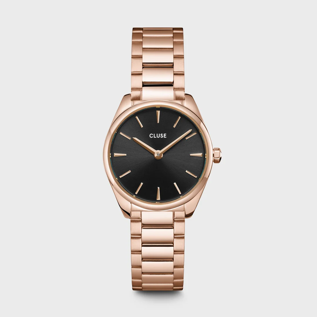 De kleinste toevoeging aan onze Féroce-collectie, maar toch uniek op zijn eigen manier. Het CLUSE Féroce Mini-horloge voor dames combineert minimalisme naadloos met strakke, uitgesproken details. Ontworpen met een zwarte wijzerplaat, rosékleurige kast van 25 mm en schakelband. Het is het perfecte minimalistische en toch opvallende kledingstuk om je look af te maken. Je kunt de bandmaat eenvoudig zelf aanpassen.