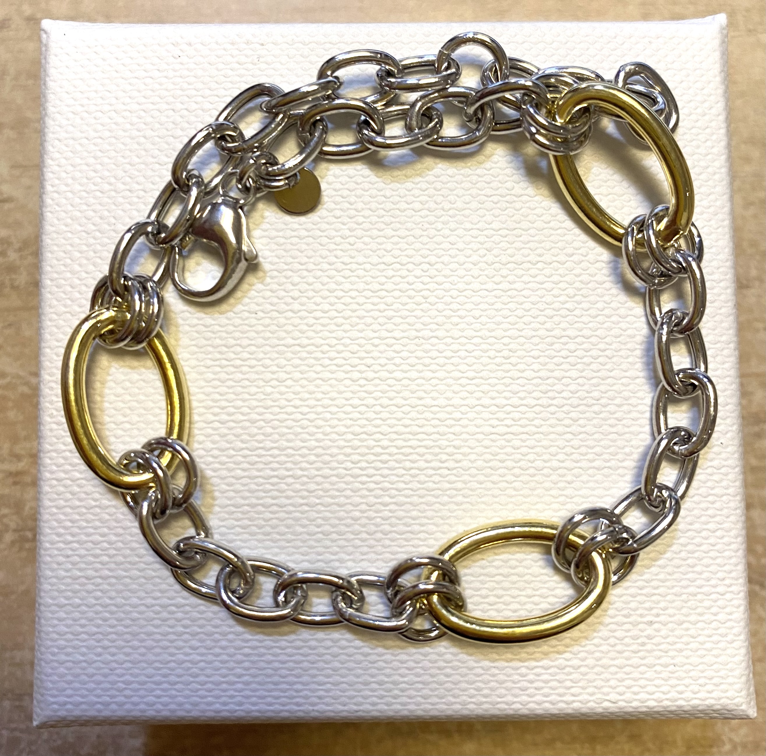 Armband zilver mer grote vergulde schakels 