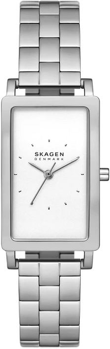 De SKAGEN HAGEN SKW3130 is een elegant en tijdloos horloge dat perfect is voor dagelijks gebruik. Met een analoge tijdaanduiding en een quartz uurwerk ben je altijd bij de tijd. De diameter van de kast is 22 mm en de hoogte is 7 mm, waardoor dit horloge subtiel om de pols zal zitten.

De rechthoekige behuizing van dit horloge is zilverkleurig en gemaakt van roestvrij staal, wat zorgt voor een luxe uitstraling. De wijzerplaat is wit en het glas is gemaakt van mineraal, wat zorgt voor een goede bescherming tegen krassen en stoten.

De zilverkleurige band van de SKAGEN HAGEN SKW3130 is gemaakt van roestvrij staal en sluit met een vlinder- of vouwsluiting, waardoor het horloge comfortabel om de pols blijft zitten. Helaas heeft dit horloge geen datumweergave, maar met de strakke uitstraling en duidelijke wijzerplaat is het aflezen van de tijd een eitje.

Dit horloge is waterdicht tot 5 bar, wat betekent dat je er mee kunt douchen. Let op: dit horloge is niet geschikt om mee te zwemmen of te duiken. SKAGEN is een bekend merk dat bekend staat om zijn minimalistische en Scandinavische ontwerpen. 