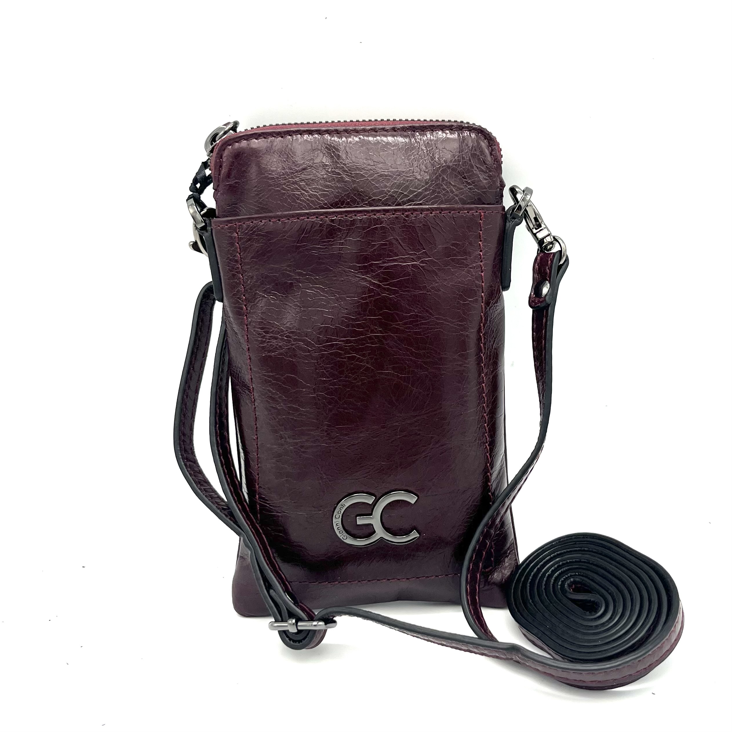Dit Gianni Conti telefoontasje in Melanzana is gemaakt van hoogwaardig leer en heeft een stijlvol design. Het tasje heeft een verstelbare schouderriem en een vakje voor je telefoon. Draag het tasje crossbody voor een trendy look. De perfecte accessoire voor onderweg! Koop hem nu en draag hem met trots bij elke gelegenheid.
Ritsvak
steekvak
afneembare en verstelbare schouderriem

Afmetingen:
Hoogte 18cm x breed 10cm x diep 2.5cm