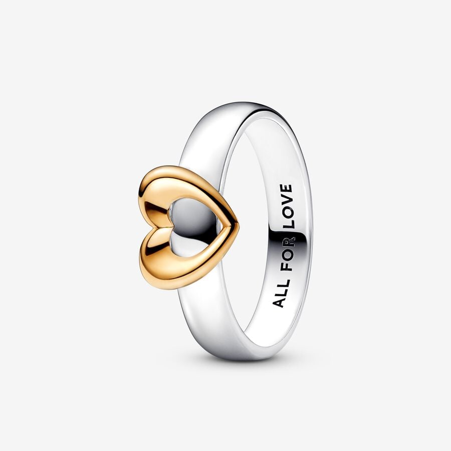 Deze prachtige Pandora ring is gemaakt van zilver en is voorzien van een geelgouden hartdetail. Het is een elegante en tijdloze toevoeging aan je sieradencollectie. Draag deze ring alleen voor een subtiele look of combineer hem met andere ringen voor een trendy stijl. De ring is verkrijgbaar in maat 52 en is perfect voor dagelijks gebruik.