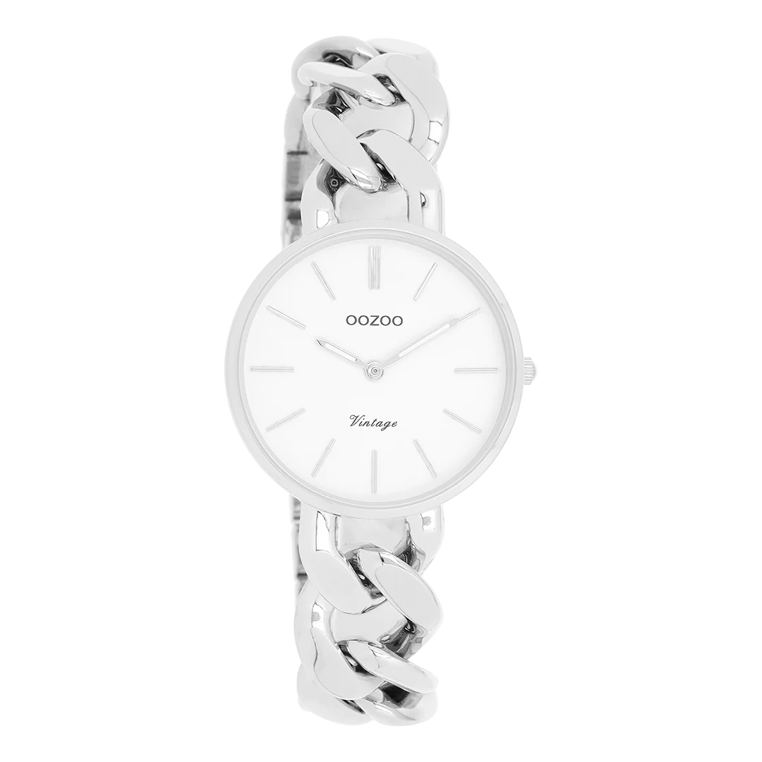 De klassieke look blijft centraal staan in deze trendy serie en daarom is dit OOZOO vintage ronde design met een speelse knipoog dé musthave van het seizoen! Dit dames horloge is de perfecte combinatie van comfort en fashion met zijn 32 mm zilverkleurige metalen horlogekast en witte wijzerplaat. De wijzerplaat heeft zilverkleurige strepen tijdsaanduidingen en bijpassende kleurige wijzers. De zilverkleurige grove schakelarmband maakt dit horloge tot een trendy accessoire dat je elke dag kunt dragen. Dit horloge voegt de sprankeling toe aan je outfit. Het mineraalglas ligt in een 6,9 mm dunne metalen horlogekast met IP-plating. De C20355 heeft een stainless steel achterplaat en is nikkel-safe. Dit horloge heeft een 2ATM Japans uurwerk en wordt gedekt door een garantie van 2 jaar
