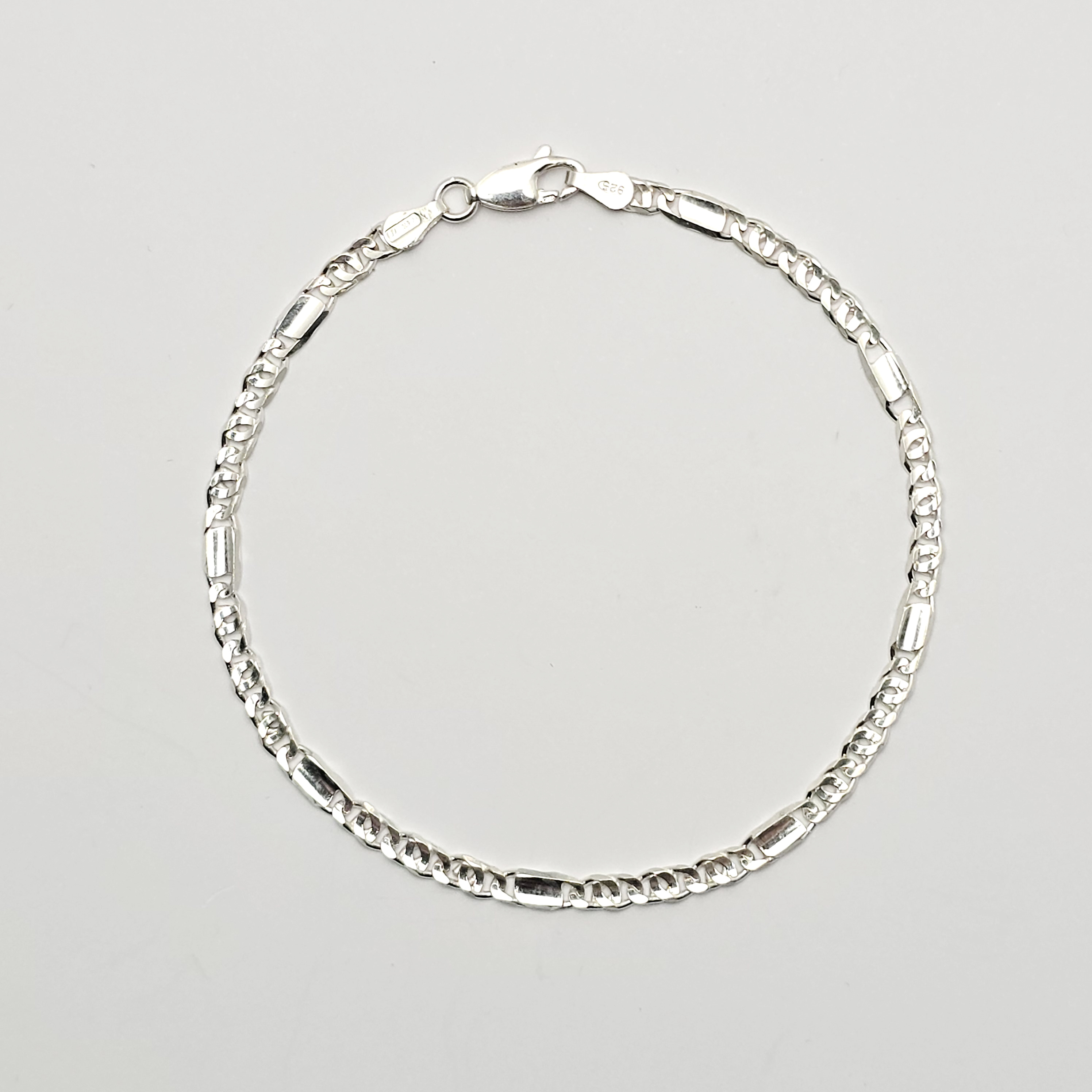 Zilveren armband met fantasie schakel. 21 cm lengte