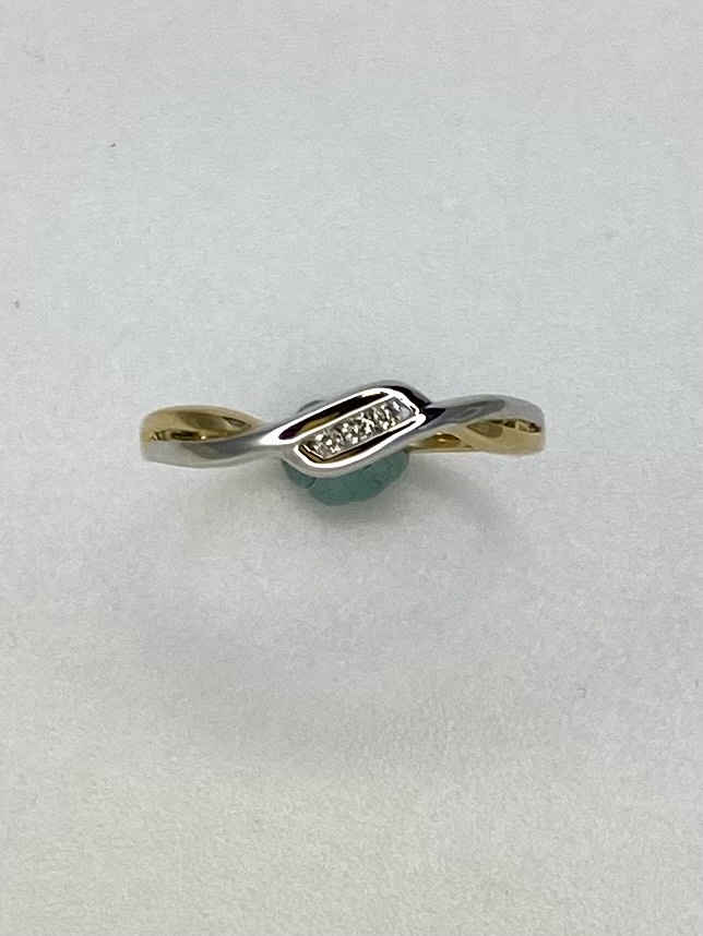 0.03crt diamant in bicolor ring