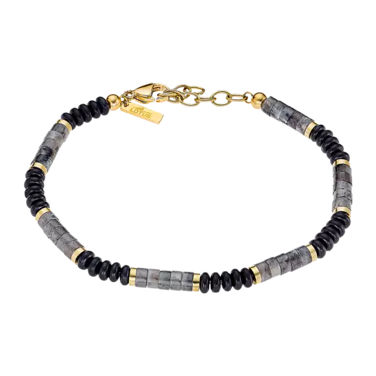 De Lotus Staal Armband voor heren is voorzien van zwarte, grijze en goudkleurige kraaltjes voor een stijlvolle uitstraling. Deze armband kan op zichzelf gedragen worden als een opvallend accessoire of gecombineerd worden met andere armbanden voor een trendy layered look. De elastische band zorgt ervoor dat de armband comfortabel om de pols past. Maak je look compleet met deze prachtige armband van Lotus Staal.