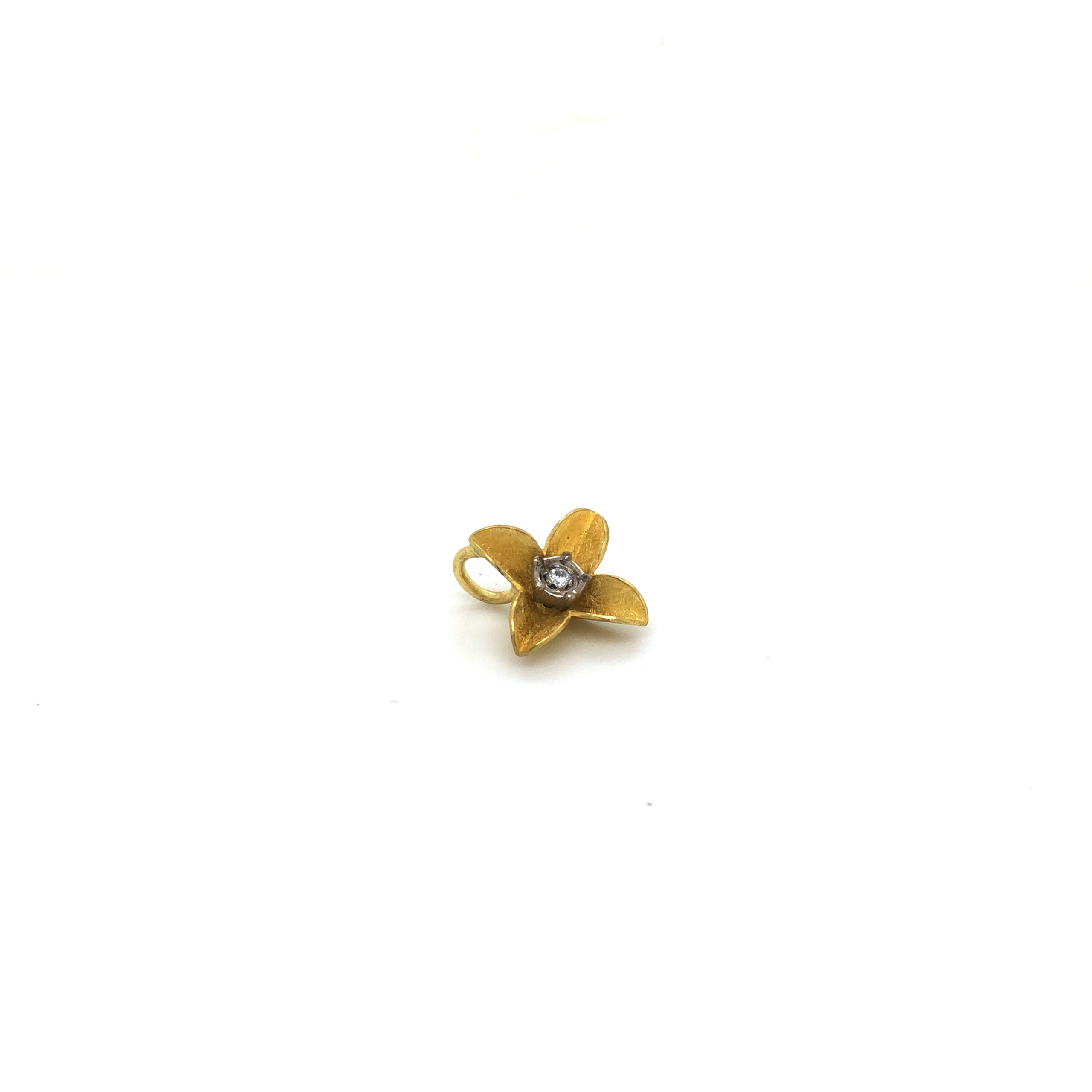 Anhänger in Blütenform in Gelbgold 750/ooo 
1 Brillant  0,06ct