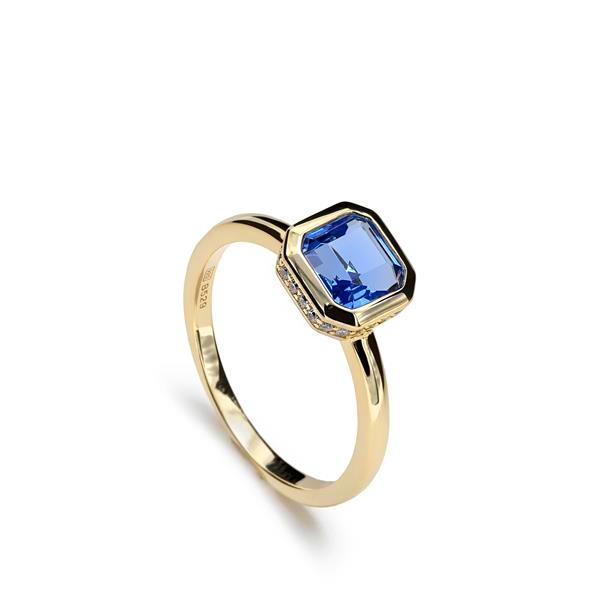 Zilver vergulde ring met blauwe topaas kleurige zirkonia .