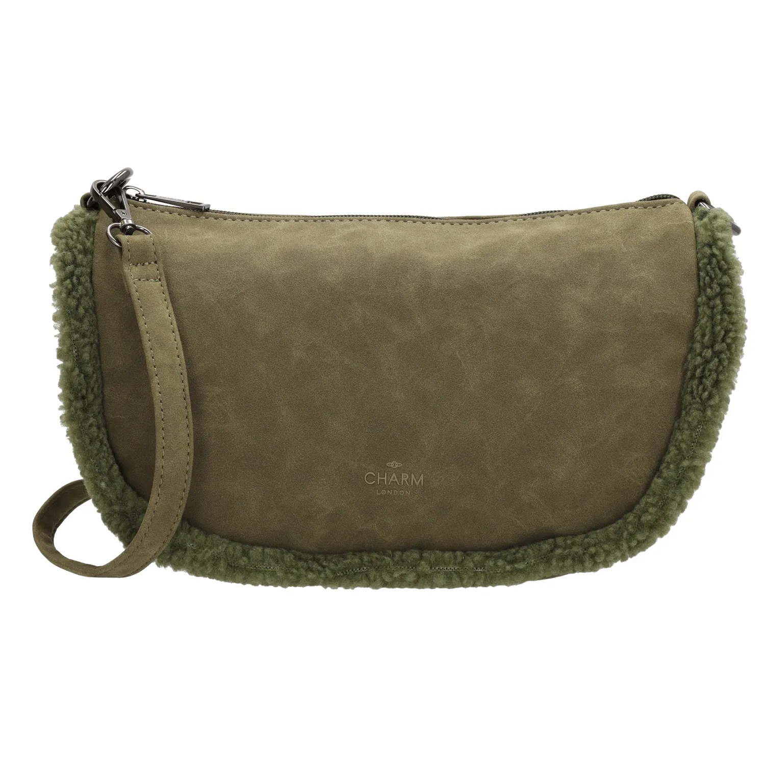 Maak kennis met de perfecte herfstaccessoire: de Charm London schoudertas! Deze schoudertas is niet alleen super stijlvol, maar ook helemaal klaar voor het seizoen dankzij de schattige teddystof randjes. Het hoofdvak is ruim genoeg voor al je essentials en sluit veilig af met een rits. Aan de achterkant van de tas vind je nog een extra ritsvakje, ideaal voor kleinere spullen die je snel bij de hand wilt hebben. De schouderband is verstelbaar en afneembaar, zodat je de tas kunt dragen zoals jij dat wilt. 