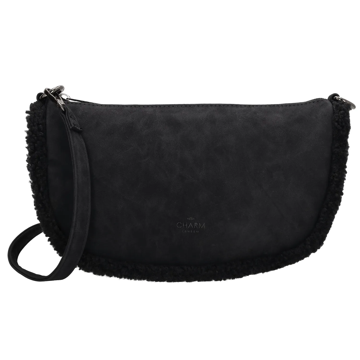 Maak kennis met de perfecte herfstaccessoire: de Charm London schoudertas! Deze schoudertas is niet alleen super stijlvol, maar ook helemaal klaar voor het seizoen dankzij de schattige teddystof randjes. Het hoofdvak is ruim genoeg voor al je essentials en sluit veilig af met een rits. Aan de achterkant van de tas vind je nog een extra ritsvakje, ideaal voor kleinere spullen die je snel bij de hand wilt hebben. De schouderband is verstelbaar en afneembaar, zodat je de tas kunt dragen zoals jij dat wilt. 