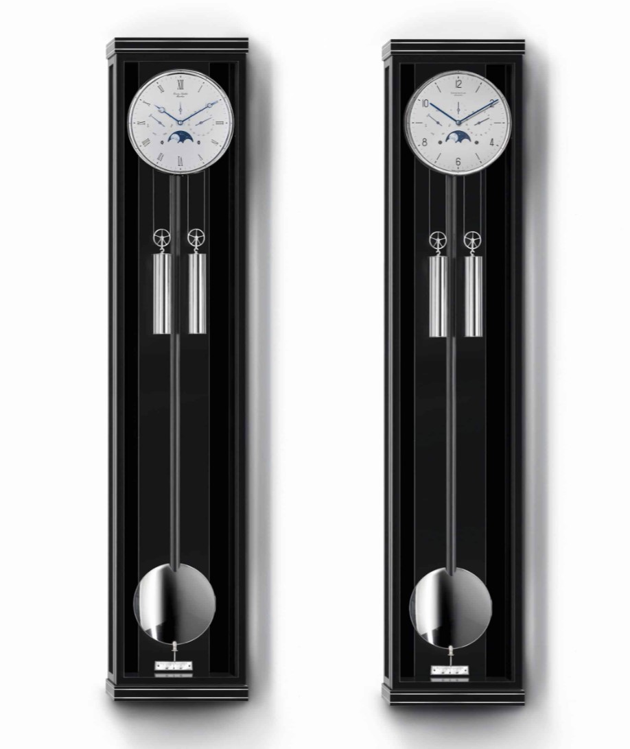ERWIN SATTLER CLASSICA KS 130 M.
Leverbaar in zwart gelakt en in zwart gelakt met Makasar achterwand met metaalinleg. 130,5 cm hoog, 27,50 cm breed en 11 cm diep. Ontspiegeld mineraal glas. Uurwerk Sattler Kaliber 1675. loopduur 30 dagen. 8 Precisie kogellagers en 15 Robijn lagers. Geanodiseerde  wijzerplaat. Geblauwde stalen wijzers. Slagwerk op de hele en de halve uren op rondgong. 