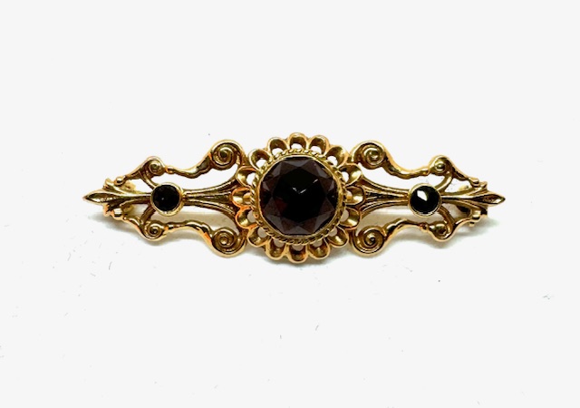 14 krt gouden broche met granaat 