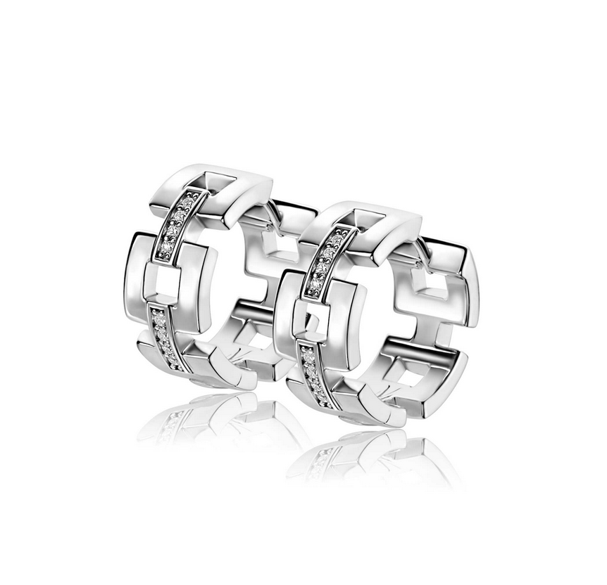 ZINZI zilveren oorringen (18 x 8mm) met vierkante schakels en schitterende verbindingsstukjes, bezet met witte zirkonia's. Exclusief ontworpen door mode-ontwerper Mart Visser. De oorringen hebben een luxe scharniersluiting. Deze zilveren luxe oorringen dragen herkenbaar de signatuur van Mart Visser. Vervaardigd van eerste gehalte zilver (925) en met extra rodiumlaag voor een langdurige glans.