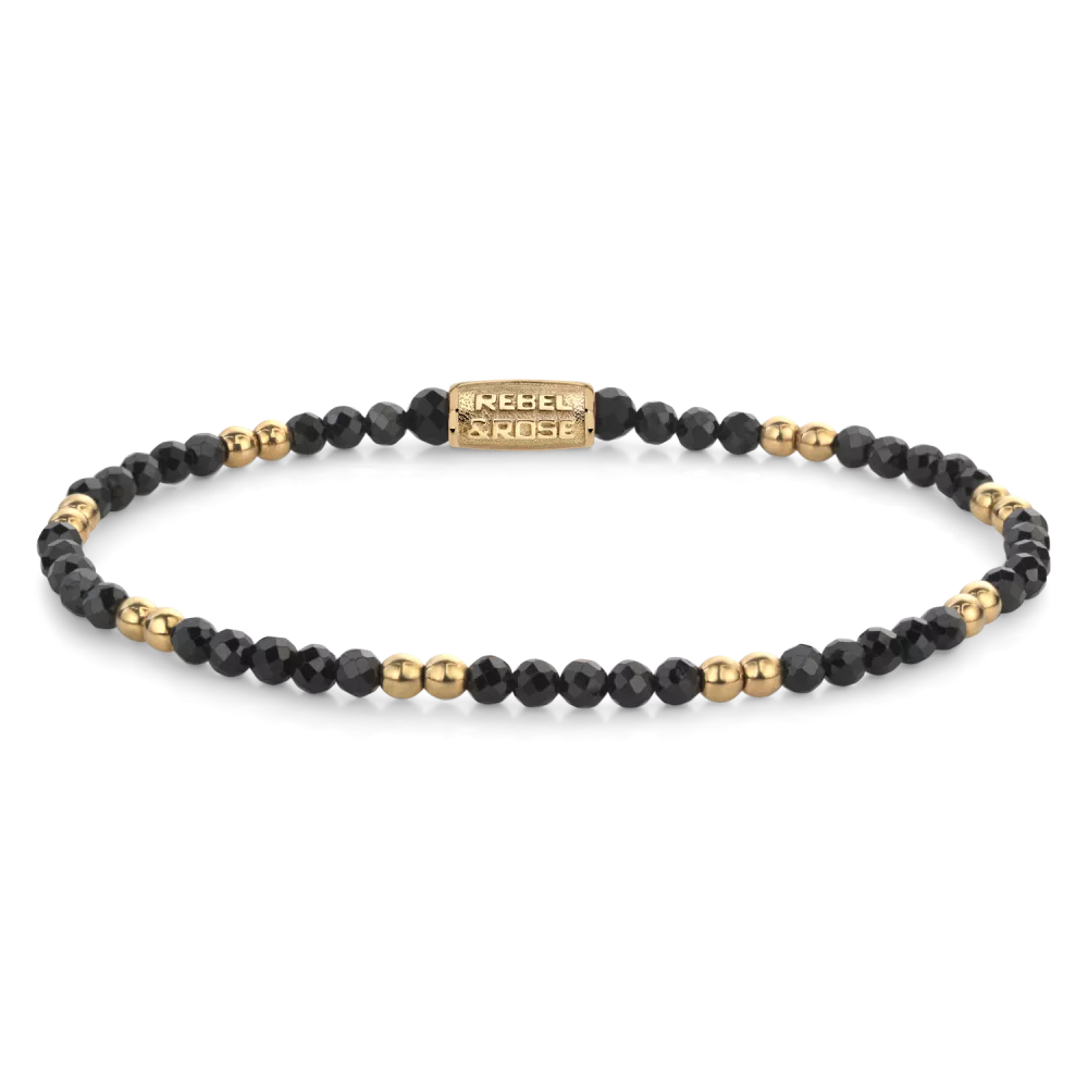 Bead armband met 3mm Black Spinel stenen, en 3mm vergulde edelstalen beads. De sluiting is gemaakt van verguld edelstaal. Het Rebel & Rose sieraad is handgemaakt en makkelijk te combineren met onze andere kralenarmbanden.

Modelnaam	Black  Glam Rocks - 3mm
Modelnr.	RR-30004-G-M
Collectie	Bracelets Beads
Type sieraad	Armband
Kleur	Goudkleurig, Zwart
Sluiting	Stainless Steel
Materiaal	Edelstenen
Steensoort	Black Spinel,
Steenkleur	Zwart, goudkleurige stalen beads
Afwerking	Polish
Breedte (mm)	3mm
Garantie	6 maanden
