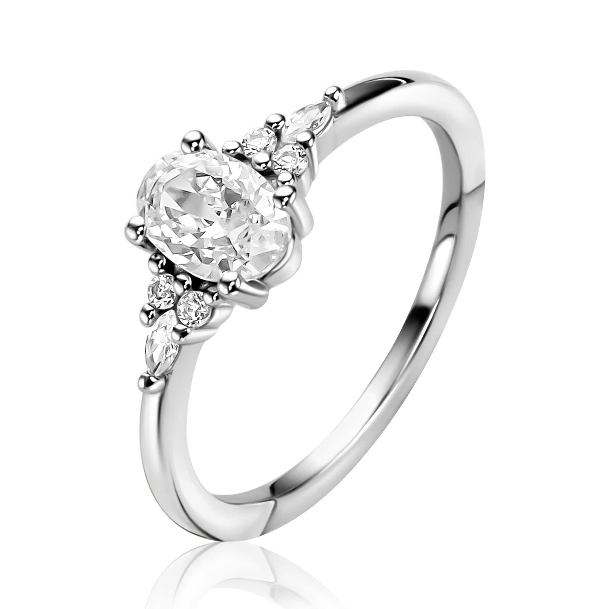 ZINZI zilveren verlovingsring met een grote ovale witte zirkonia (7mm) in vierpootszetting in het midden en kleinere witte zirkonia's in de scheen. Leuk detail: het kleine hartje aan de zijkant van de zetting. Vervaardigd van eerste gehalte zilver (925) en met extra rodiumlaag voor een langdurige glans.