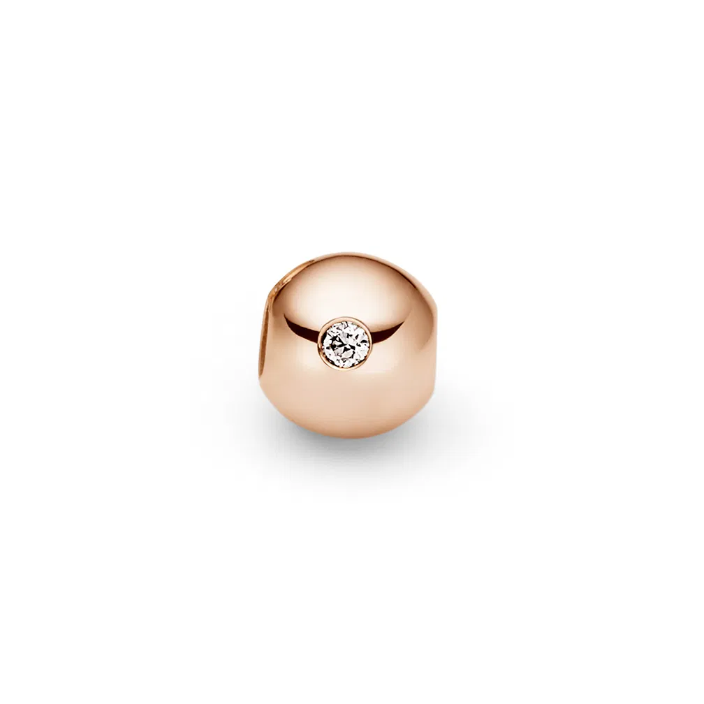 Een 18 krt geelgouden kogel voor aan Niessing armband Colette met een diamant briljant geslepen 0,01 crt tw vs.