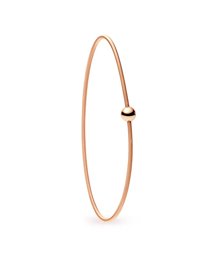 Een 18 krt rosé gouden Niessing Colette armband 1 wikkeling. met een diamant briljant geslepen 0.02 crt tw vs.