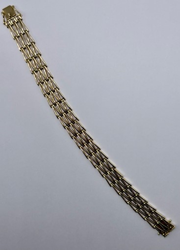 14 Karaat geel gouden dames fantasie armband met gepende schakel en met een bak slot sluiting. schakelbreedte 12.8 mm. lengte 20 cm.
