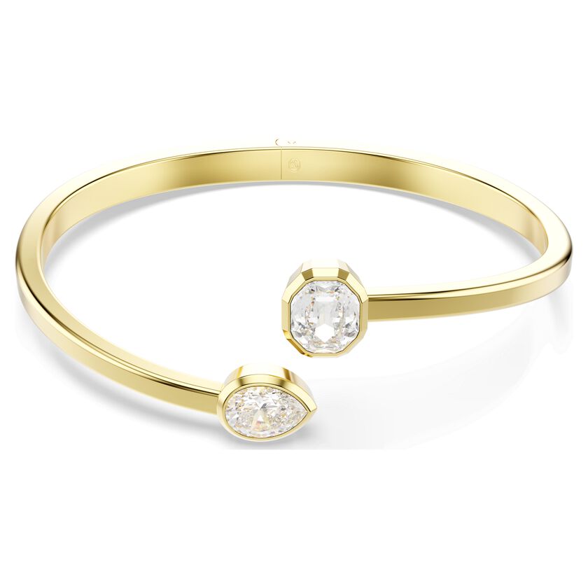 Deze stralende Imber-armband combineert klassieke stijl met een moderne touch en is gemaakt om in de schijnwerpers te staan. Het open ontwerp heeft een goudkleurige toplaag en is voorzien van Swarovski Zirkonia in de Pear- en Octagon-slijpvorm in een moderne bezelzetting. De perfecte manier om elke outfit een vleugje luxe te geven die moeiteloos combineert met een paar bijpassende oorbellen uit dezelfde collectie.