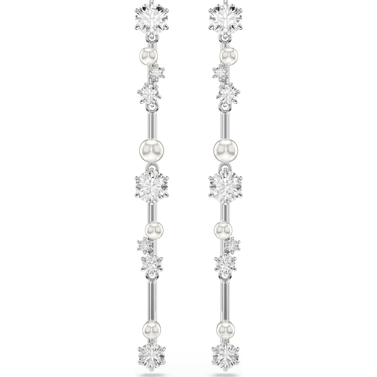Als sterrenstof aan de hemel zijn deze Constella-oorhangers gevuld met magie en licht. De oorbellen hebben een rhodium toplaag en zijn voorzien van een cluster Swarovski Zirkonia en Crystal Pearls in verschillende formaten, die lijken te zweven tussen de metalen lijnen van het sieraad. Een sensationele aanvulling op elke outfit die uw kosmische gloed versterkt.
