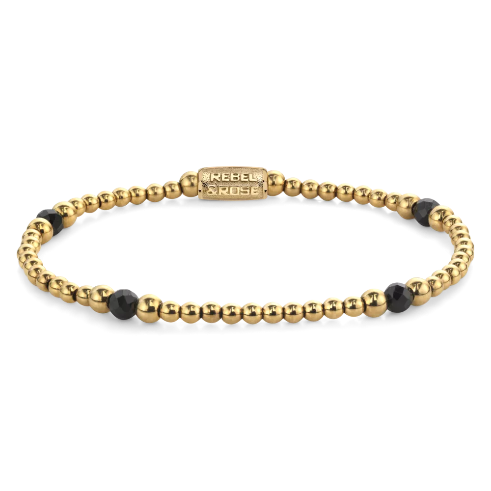Edelstenen bead armband, handgemaakt van 4mm Black Spinel gefaceteerde kralen, afgewisseld met 3mm en 4mm vergulde edelstalen beads. De sluiting is gemaakt van verguld edelstaal. Het Rebel & Rose sieraad is makkelijk te combineren met onze andere kralenarmbanden.

Modelnaam	Touch of Black Glam Rocks - 4mm
Modelnr.	RR-40151-G-M
Collectie	Bracelets Beads
Type sieraad	Armband
Kleur	Goudkleurig, Zwart
Sluiting	Stainless Steel
Materiaal	Edelstenen
Steensoort	Black Spinel,
Steenkleur	Zwart, goudkleurige stalen beads
Afwerking	Polish
Breedte (mm)	4mm
Garantie	6 maanden