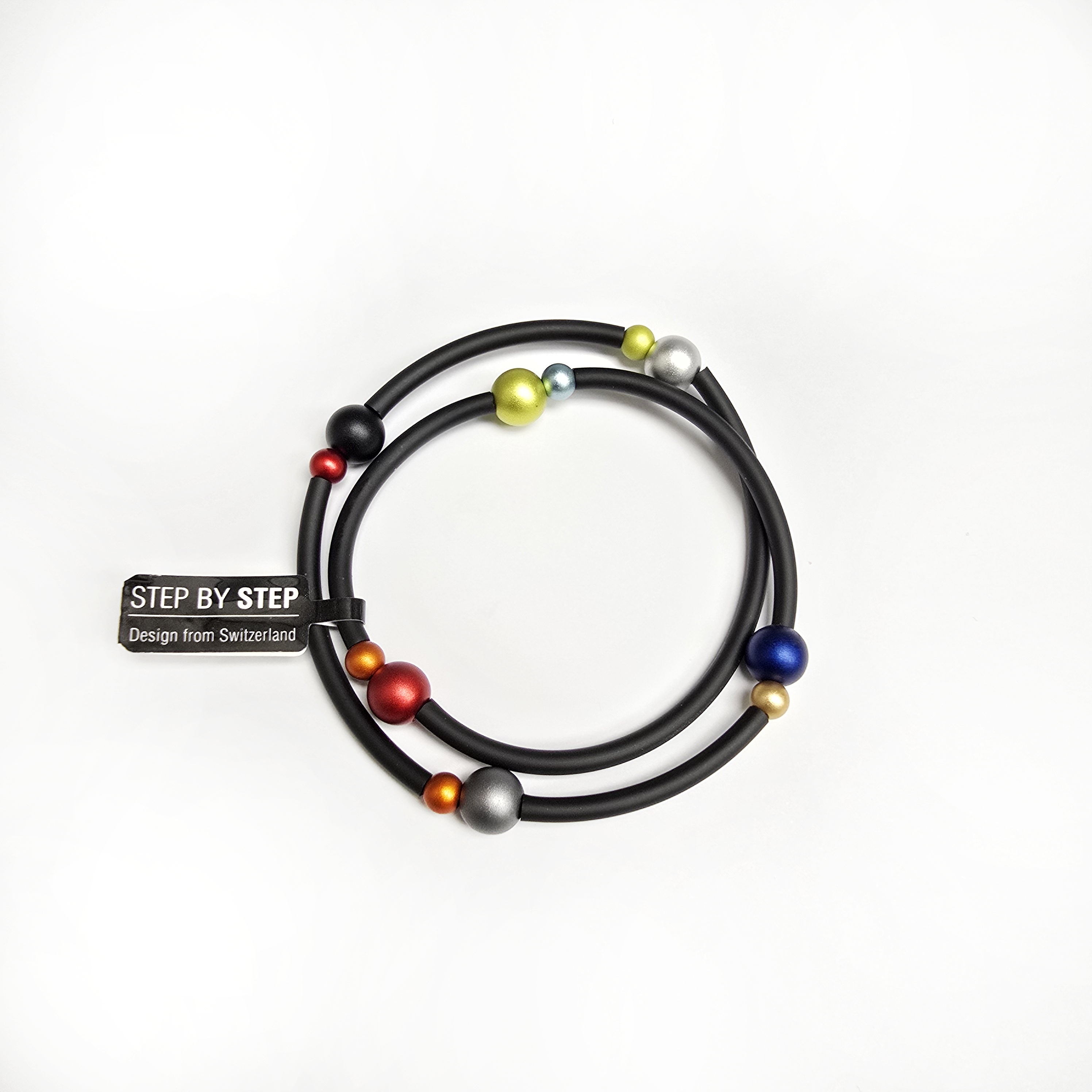 Rubberen armband met meerkleurige bolletjes