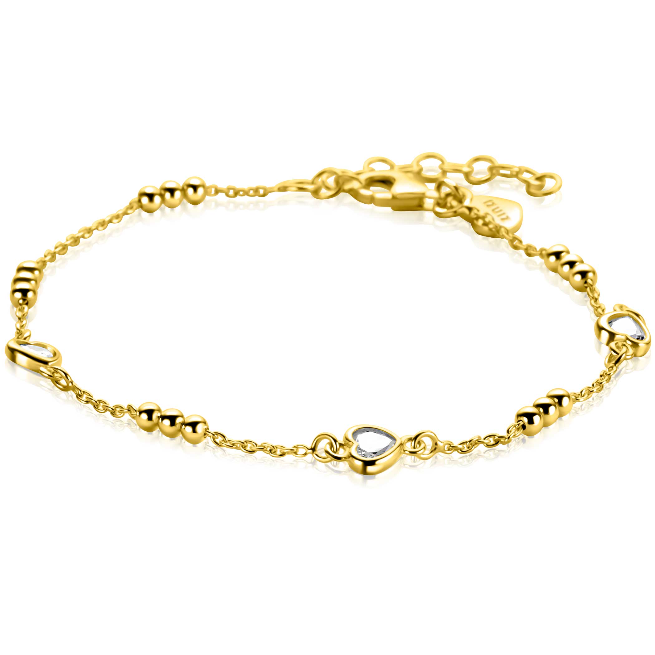 ZINZI gold plated zilveren schakelarmband met trio-bolletjes en drie hartvormige zettingen, bezet met witte zirkonia's. Combineer de armband met de bijpassende ketting en maak gemakkelijk een chique look. De lengte van de armband is te variëren tussen de 17cm en 20cm. Vervaardigd van eerste gehalte zilver (925) en extra geel verguld.