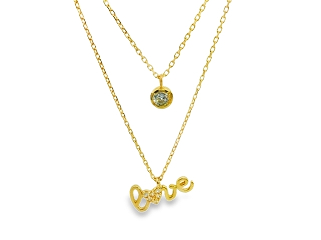 Dit prachtige geelgouden dubbele collier van 14 karaat (2.63 gr) is versierd met schitterende zirkonia steentjes. Het collier kan op verschillende manieren gedragen worden, zoals in laagjes of juist als statement piece. De combinatie van goud en zirkonia geeft een luxe uitstraling aan elke outfit. Een echte eyecatcher voor elke gelegenheid!