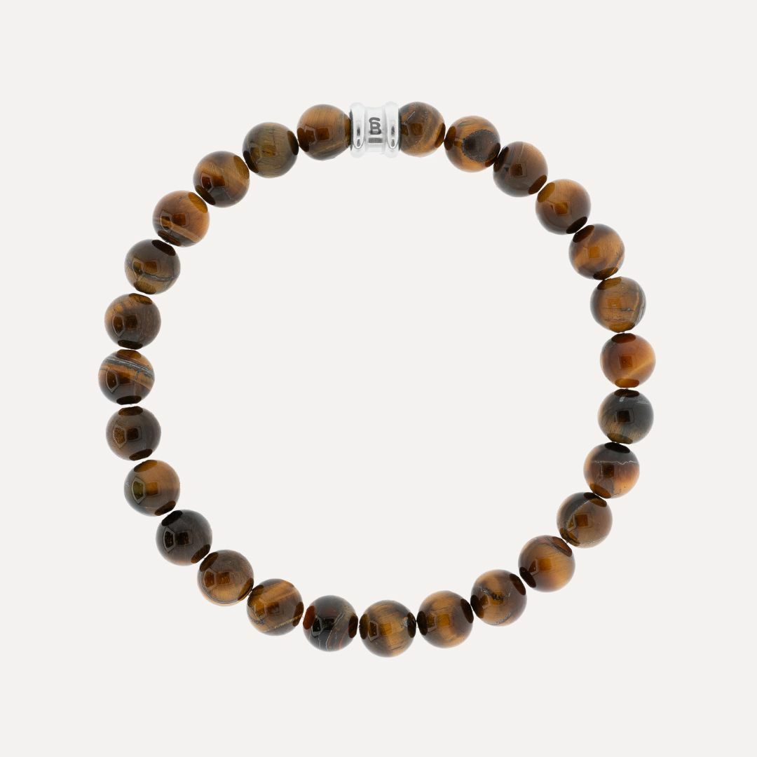 Deze heren armband van Steel&Barnett is gemaakt van hoogwaardige kralen met een tijgerprint. Het heeft een basic en stoere uitstraling die perfect is voor dagelijks gebruik. De armband kan gemakkelijk worden gecombineerd met andere sieraden voor een trendy look. Draag hem los om je pols of stapel hem met andere armbanden voor een opvallende stijl. Maak je outfit compleet met deze unieke armband.