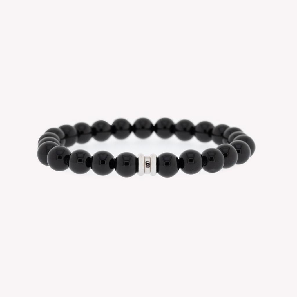 Deze stoere armband van Steel&Barnett is gemaakt van zwart glanzende kralen en heeft een elegant design. De armband is perfect voor heren die houden van een stijlvolle en moderne accessoire. Met deze armband maak je elke outfit compleet!