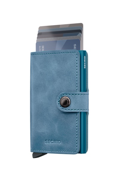 Miniwallet Vintage Teal is gecorrigeerd leer, gemaakt in Nederland van Europese runderhuiden.  

Draagt
4 verdikte of 6 platte kaarten
4 extra kaarten
Bankbiljetten
Visitekaartjes
Bonnetjes
Afmetingen en gewicht
65 x 102 x 21 mm
72 g