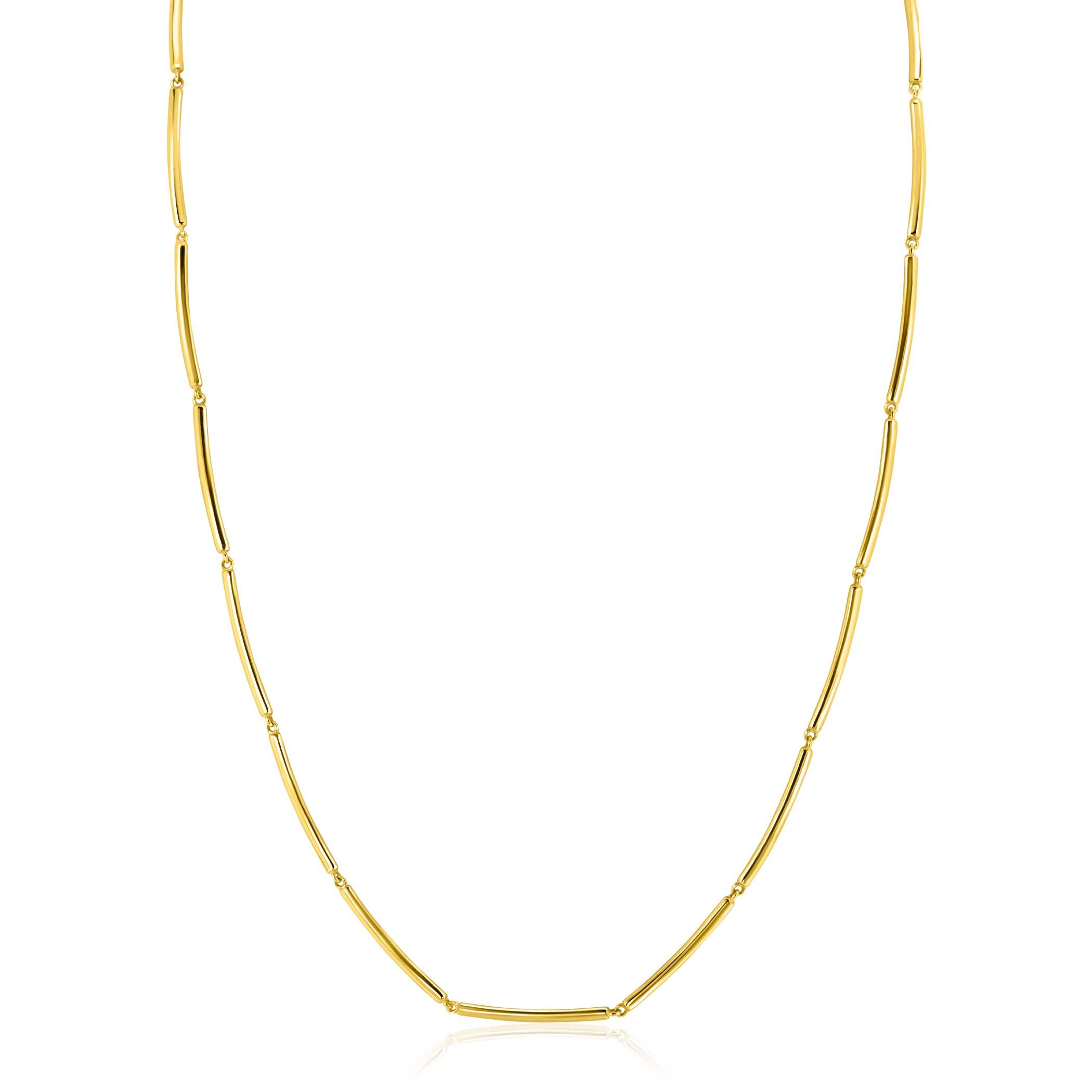 De ZINZI gouden collier  is een elegant sieraad met een verfijnde staafjesontwerp, gemaakt van 14K goud. Deze stijlvolle ketting is perfect voor zowel dagelijkse als speciale gelegenheden. Draag het collier solo voor een subtiele look of combineer het met andere sieraden voor extra flair. Een must-have voor iedere sieradenliefhebber!