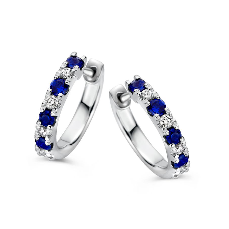Schitterende witgouden oorringen gezet met diamant en blauwe saffier.
