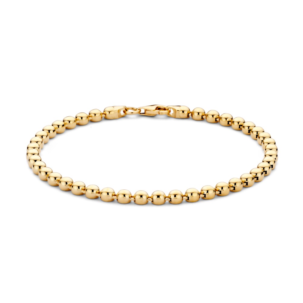 Soepele geelgouden armband met gouden bolletjes. Leuk om zo te dragen, maar ook perfect te combineren met andere armbanden voor een speelse look.
