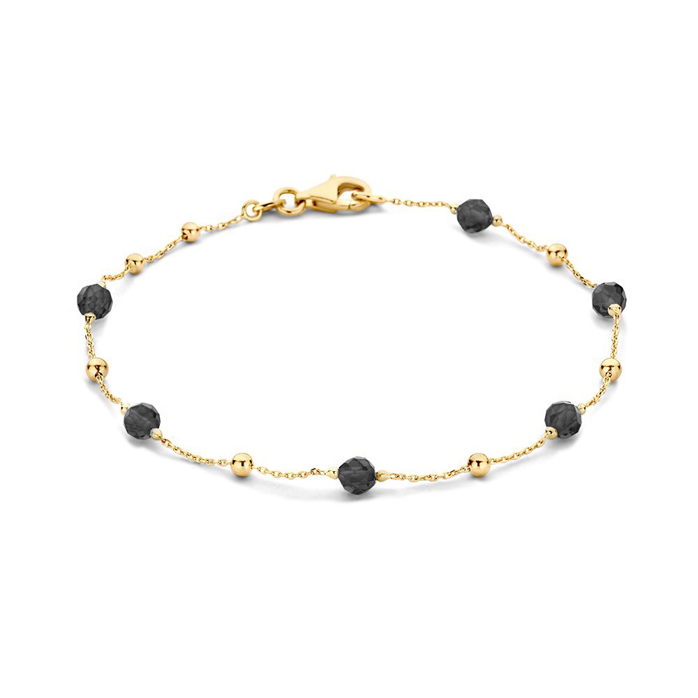Geelgouden collier metgouden bolletjes en zwarte zirkonia elementen. Voeg kleur toe aan jouw sieraden look!
