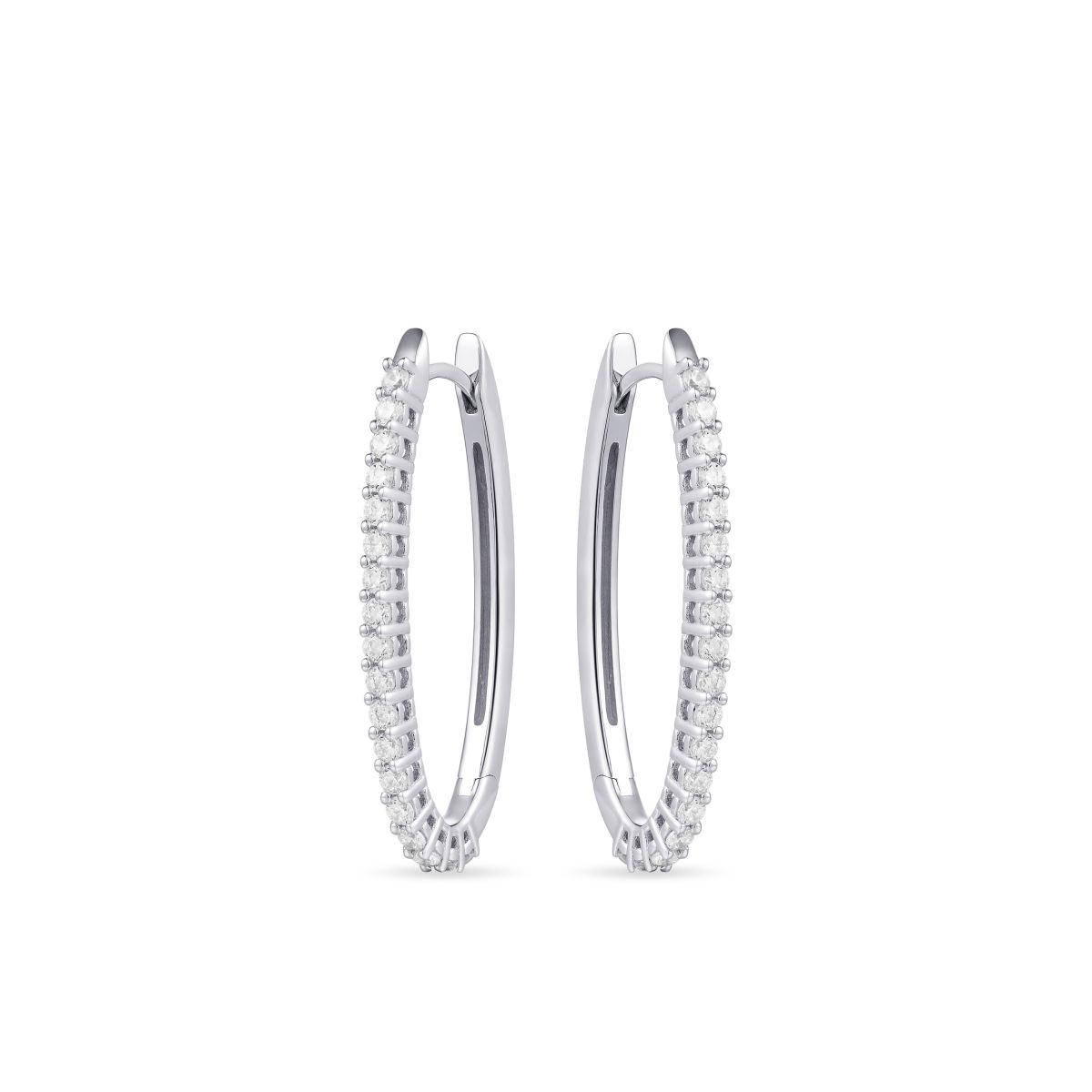 De Gisser Jewels zilveren oorbellen, model KCN2/35, zijn zilveren ovale oorringen met zirkonia. Ze hebben een breedte van 3 mm en een diameter van 35 mm. Deze elegante oorbellen passen perfect bij zowel casual als formele outfits. Draag ze om elke look een vleugje verfijning en glans te geven.