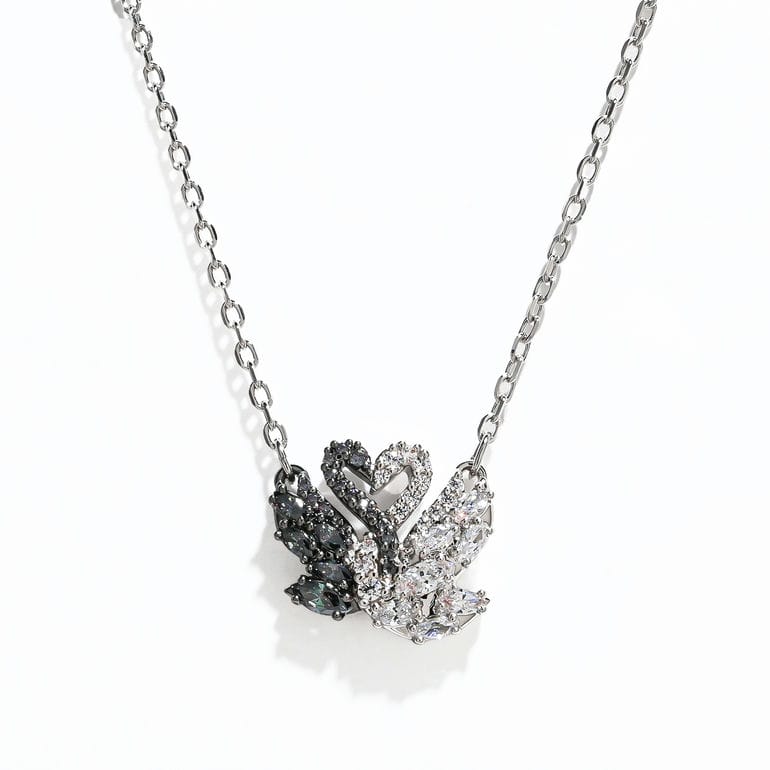 Celebrating Swarovski’s eternal emblem of love and beauty, this swan pendant will infuse any outfit with elegance. Suspended from a delicate chain, the central motif showcases two intertwined swans, in rhodium and ruthenium plating, with an all-over decoration of black and white Swarovski Zirconia in round and marquise cuts. A beautiful example of Swarovski savoir-faire that will remain forever timeless.