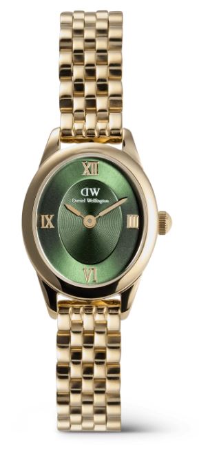 De Ophelia Mini Watch heeft een wijzerplaat met een elegante ovale vorm die afwijkt van traditionele horloges. Dit unieke nieuwe dameshorloge biedt veel vernieuwing. Het wordt geleverd met een nieuw ontworpen beans link band en een vlindersluiting. De iets zwaardere ovale kast benadrukt de elegante silhouet, terwijl de taps toelopende aanzetten zorgen voor een soepele overgang naar de schakelarmband. Het horloge heeft metalen Romeinse cijfers bovenop een schijfpatroon in het midden van de sunray wijzerplaat, en zowel de kast als de armband zijn gepolijst tot een gedurfde, glanzende afwerking.