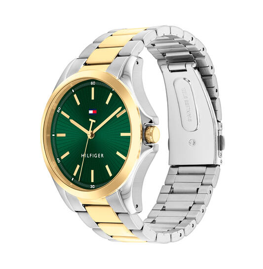 Tommy Hilfiger TH1792192 Horloge Heren 43mm
Dit specifieke horloge van Tommy Hilfiger uit de Bruce serie met artikelnr: TH1792192 is een stijlvol herenhorloge die niet in je collectie mag ontbreken. Het herenhorloge heeft een ronde stalen kast met een goudkleurige bezel en een blauwe wijzerplaat met goudkleurige uursaanduiding en wijzers. Aan de kast zit een stalen bicolor schakelband met een vouwsluiting. Het horloge heeft een mineraalglas, een afmeting van 43mm en is 3ATM.  

Het merk:
Sinds de lancering van het merk in 1985 is Tommy Hilfiger wereldwijd bekend geworden als pionier van de klassieke Amerikaanse coole stijl. Geïnspireerd door de iconische popcultuur en het Amerikaanse erfgoed. De dames en herencollectie van dit seizoen bestaan uit minimalistische silhouetten en rustieke lederen details. De herenhorlogecollectie biedt iconische uurwerken met roestvrijstalen, lederen en siliconen banden.

Specificaties:
- Mineraalglas
- Ronde kast 43mm
- Stalen horlogekast
- Blauwe wijzerplaat
- Stalen bicolor schakelband 
- 3ATM