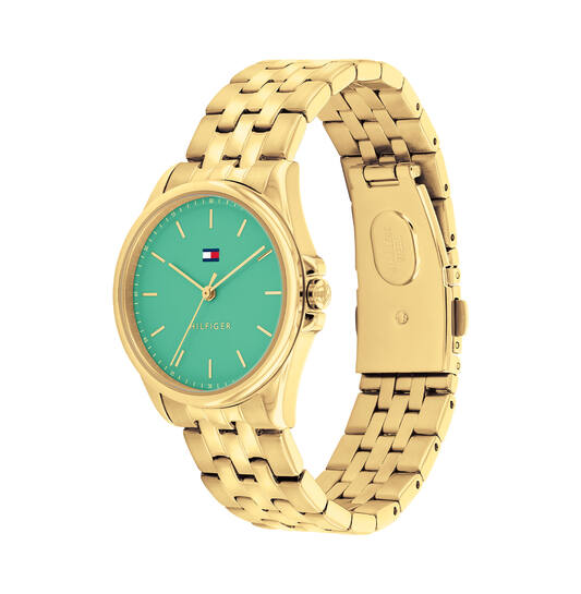 Tommy Hilfiger TH1782774 Horloge Dames Staal Goudkleurig 30mm
Dit specifieke horloge van Tommy Hilfiger uit de Jade serie met artikelnr: TH1782774 is een luxe dameshorloge die niet in je collectie mag ontbreken. Het stalen dameshorloge heeft een ronde goudkleurige kast met een gladde bezel en een groene emaille wijzerplaat met fijne wijzers en het Tommy logo. Aan de kast zit een goudkleurige glanzende schakelband met vouwsluiting. Het horloge heeft een mineraalglas, een afmeting van 30mm en is 3ATM.  

Het merk:
Sinds de lancering van het merk in 1985 is Tommy Hilfiger wereldwijd bekend geworden als pionier van de klassieke Amerikaanse coole stijl. Geïnspireerd door de iconische popcultuur en het Amerikaanse erfgoed. De dames en herencollectie van dit seizoen bestaan uit minimalistische silhouetten en rustieke lederen details. De herenhorlogecollectie biedt iconische uurwerken met roestvrijstalen, lederen en siliconen banden.

Specificaties:
- Mineraalglas
- Ronde kast 30mm
- Goudkleurige horlogekast
- Groene emaille wijzerplaat
- Goudkleurige schakelband 
- 3ATM