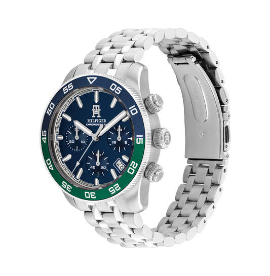 Tommy Hilfiger TH1792185 Horloge Heren Chrono 41mm
Dit specifieke horloge van Tommy Hilfiger uit de TH85 serie met artikelnr: TH1792185 is een stoer herenhorloge die niet in je collectie mag ontbreken. Het herenhorloge heeft een ronde stalen kast met een blauw/groene aluminium bezel en een blauwe wijzerplaat met chronograaf en datum. Aan de kast zit een stalen schakelband met vouwsluiting. Het horloge heeft een mineraalglas, een afmeting van 41mm en is 5ATM.  

Het merk:
Sinds de lancering van het merk in 1985 is Tommy Hilfiger wereldwijd bekend geworden als pionier van de klassieke Amerikaanse coole stijl. Geïnspireerd door de iconische popcultuur en het Amerikaanse erfgoed. De dames en herencollectie van dit seizoen bestaan uit minimalistische silhouetten en rustieke lederen details. De herenhorlogecollectie biedt iconische uurwerken met roestvrijstalen, lederen en siliconen banden.

Specificaties:
- Mineraalglas
- Ronde kast 41mm
- Stalen horlogekast
- Blauwe wijzerplaat
- Stalen horlogeband 
- 5ATM
- Chronograaf