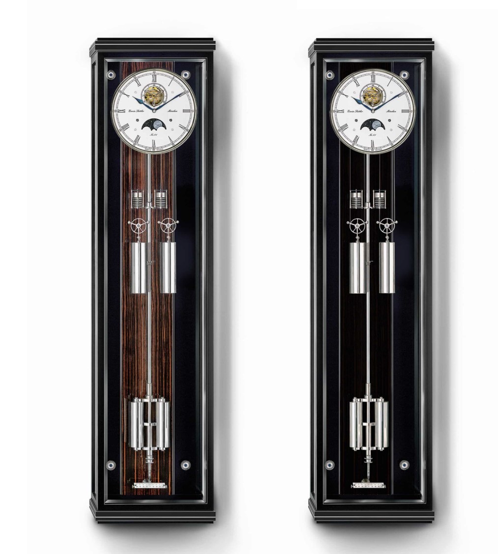 ERWIN SATTLER SECUNDA SONATA.
De trotse bezitter van zo'n handgemaakt uurwerk kan niet alleen genieten van het rustgevende tikken van het uurwerk, maar ook van het warme geluid van de gong die elk half en heel uur slaat. Naast de aangename klank is de klok ook voorzien van een met de hand beschilderde maanschijf, die de verzilverde wijzerplaat een bijzondere uitstraling geeft. De combinatie van deze twee functies verenigt visuele schoonheid en akoestiek.

Zoals gebruikelijk bij nauwkeurige slingerklokken van Erwin Sattler is de slinger van de Secunda Sonata voorzien van temperatuur- en luchtdrukcompensatie. Het vergulde tandwielstelsel is volledig gelagerd op kogel- en robijnlagers en het klassieke Graham-echappement is geoptimaliseerd door agaatpaletten. Dit exclusieve ensemble wordt gepresenteerd in een stijlvolle, modern vormgegeven kast, die wordt gecompleteerd door metalen inlegwerk en naar keuze een zwarte- os een Makassar-cassette in de achterwand.
Kast maten 145 cm hoog, 37 cm breedt en 18 cm diep. Facet geslepen mineraal glas. Uurwerk Sattle Kaliber 2015 met zichtbare Graham ankergang. Loopduur 30 dagen. Invar Compensatie slinger met temperatuur- en luchtdrukcompensatie. 20 Precisie kogellager. 4 in chatons verschroefde Robijn lagers en 2 Agaat anker paletten. Verzilverde wijzerplaat met handbeschilderde maanschijf. Geblauwd stalen wijzer. Slagwerk op het hele en het halve uur op een rustig klikkende gong.