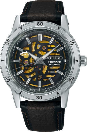 Dit is een herenhorloge van het merk Seiko. Het is een analoog horloge gemaakt van staal. De diameter van de kast is 39.5 mm en de kast is 12 mm dik. 
De verdere specificaties van het horloge zijn als volgt:
Kastvorm: rond
Kastkleur: zilverkleurig
Wijzerplaatkleur: zwart skeleton met goudkleurig uurwerk
Kastmateriaal: staal
Bandbreedte: 20 mm
Bandlengte: 259.5 mm
Sluiting: gesp
Glassoort: hardlex mineraal glas
Waterdichtheid: 5 ATM
Techniek: automaat