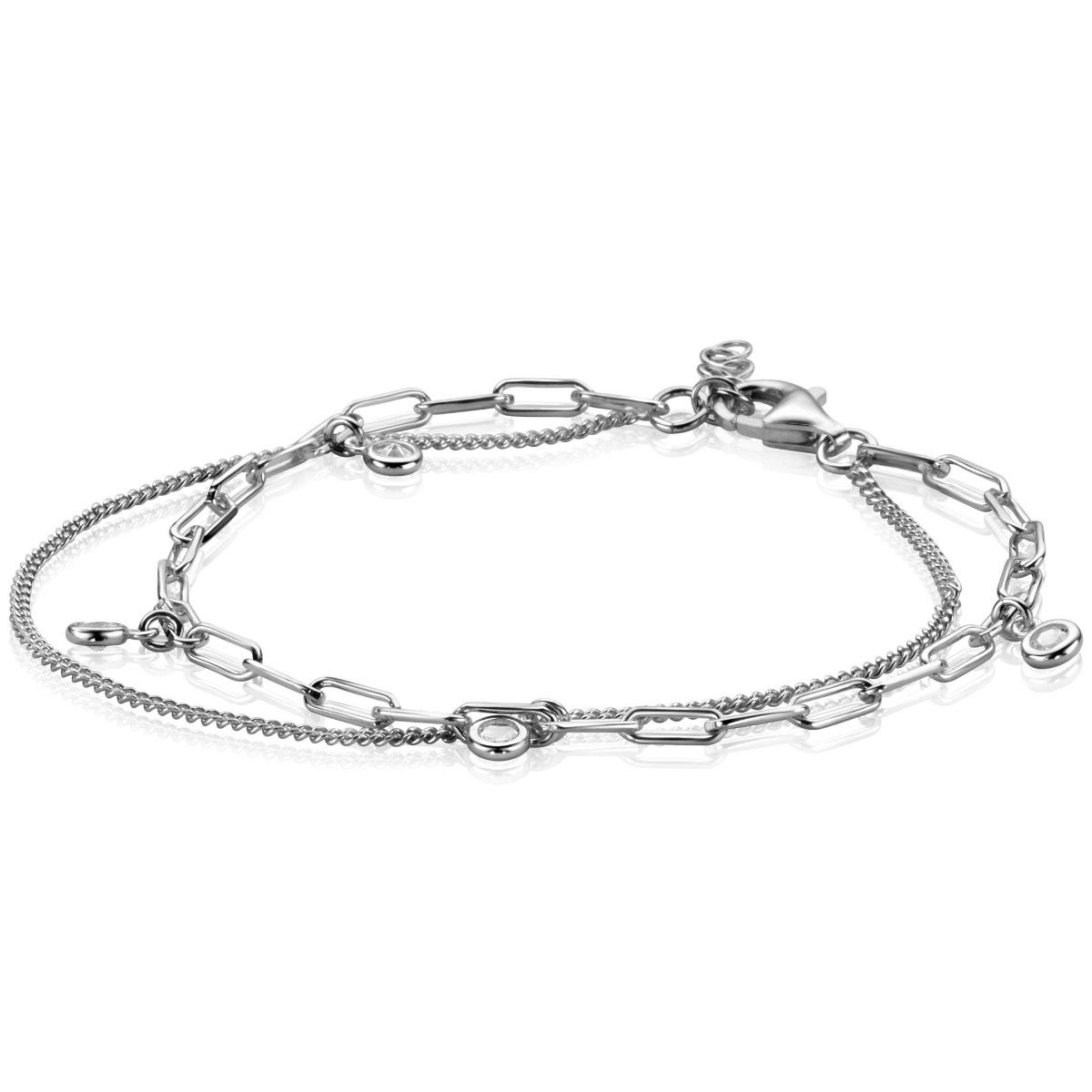 ZINZI zilveren multi-look armband met twee verschillende trendy schakels: de gourmet schakel en de paperclip schakel. Aan de paperclip schakel zijn 4 ronde witte zirconia's verbonden. Het geeft de armband een '2 in 1' uitstraling. Met herkenbaar Zinzi hartje bij de sluiting. De lengte van de armband is te variëren tussen 16,5 en 19,5cm. De armband is vervaardigd van eerste gehalte zilver (925) en voorzien van een extra rodiumlaag voor een langdurige glans.