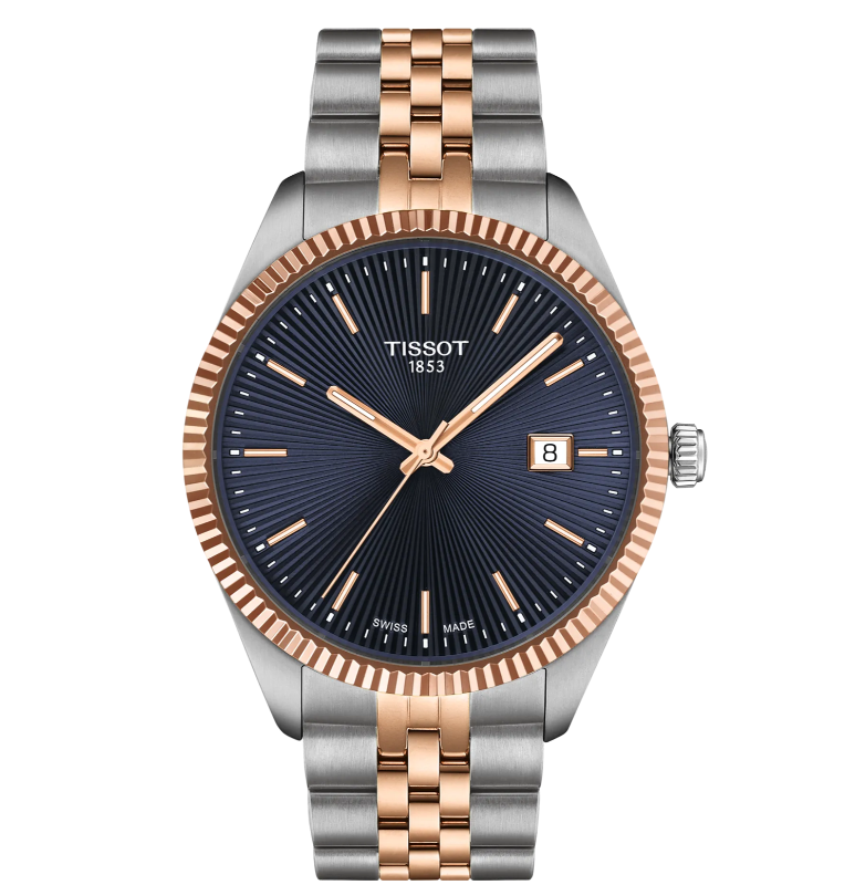 De TISSOT BALLADE T156.410.22.041.00 40MM is een prachtig horloge met een klassieke uitstraling en moderne functionaliteiten. Dit horloge heeft een analoge tijdsaanduiding en wordt aangedreven door een betrouwbaar quartz uurwerk. Met een diameter van 40 mm en een hoogte van 8 mm heeft dit horloge een elegant formaat dat perfect is voor zowel mannen als vrouwen.

De ronde behuizing van de TISSOT BALLADE is zilverkleurig en gemaakt van hoogwaardig roestvrij staal. De blauwe wijzerplaat geeft het horloge een stijlvolle uitstraling en wordt beschermd door krasbestendig saffierglas. De bicolor roestvrij stalen band zorgt voor een luxe uitstraling en biedt optimaal draagcomfort.

Dit horloge is voorzien van een handige datumweergave en is waterdicht tot 10 bar, wat betekent dat het geschikt is om mee te zwemmen. De vlinder- of vouwsluiting zorgt ervoor dat het horloge veilig om de pols blijft zitten en gemakkelijk te openen en sluiten is.

Diameter:40 mm
316L roestvrijstalen kast met ros&eacute;gouden PVD-coating
Zwitsers kwartsuurwerk
Krasbestendig saffierglas met antireflecterende coating
Verwisselbare band met snelsluiting