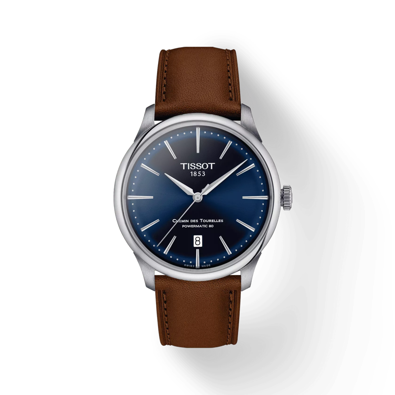 De Tissot Chemin des Tourelles Powermatic, is een elegante polshorloge met een roestvrijstalen kast en een bruine lederen band. Voorzien van een datumaanduiding, straalt het zowel klasse als functie uit. Draag het bij formele of zakelijke gelegenheden voor een verfijnde look. Perfect voor elke stijlvolle gelegenheid.