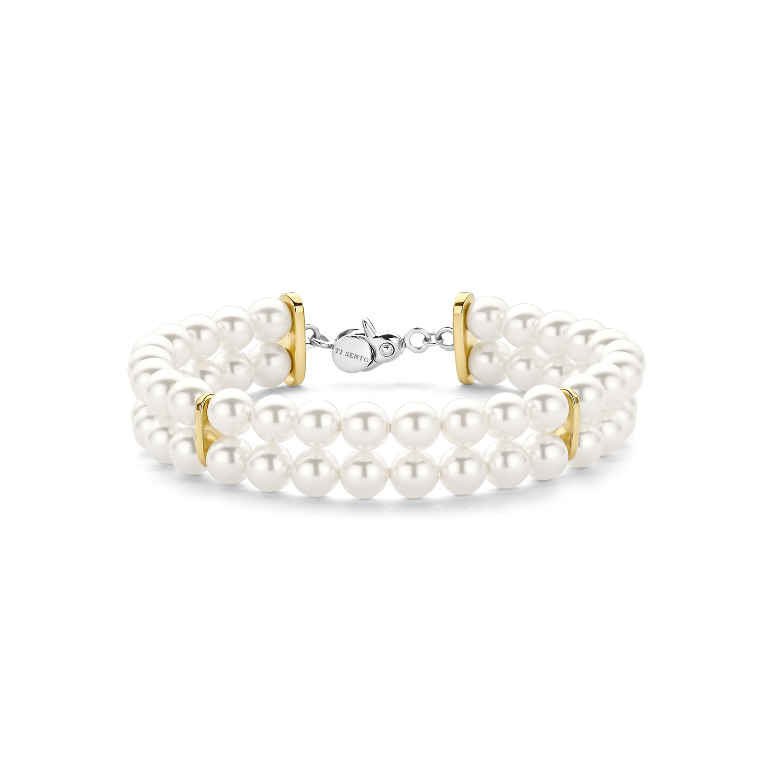 Voeg een vleugje moderne verfijning toe aan je dagelijkse look met de TI SENTO armband 23079SY, een elegante balans tussen design en luxe. Vervaardigd uit 925 sterling zilver en afgewerkt met warme geelgouden kleur, beschikt deze verfijnde armband over een opvallend geometrisch zeshoekig ontwerp. De wisselwerking tussen zachte rondingen en scherpe hoeken cre�ert een boeiend visueel effect, terwijl de warme plating een luxe warmte toevoegt. Deze bangle viert individualiteit en is een bewijs van de kracht van ingetogen elegantie. Draag de armband solo voor een minimalistische statement of combineer het met andere TI SENTO sieraden voor een samengestelde en verfijnde look. Vervaardigd met zorg voor de gevoelige huid, biedt deze nikkelvrije en hypoallergene armband langdurig comfort en kwaliteit.