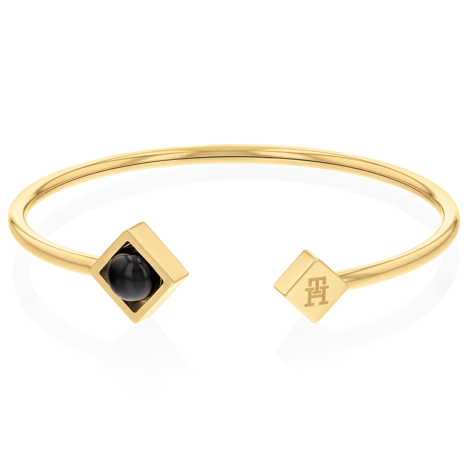 Tommy Hilfiger Jewels TJ2780795 Armband Dames Onyx
Deze armband van Tommy Hilfiger uit de jewelry serie met nr: TJ2780795 is een opvallend model. De goudkleurige stalen open bangle armband heeft bovenop een vierkant kastje met een ronde zwarte onyx steen en een plaatje met het Tommy logo. Zeker leuk te combineren met de bijpassende sieraden uit de set van Tommy Hilfiger.

Het merk:
Tommy Hilfiger is wereldwijd één van de grootste designer lifestyle merken en is internationaal bekend om haar classic American cool stijl. De sieraden zijn voor dames en heren met een eigen stijl, die niet bang zijn om dit aan de wereld te laten zien.

Specificaties:
- Artikelnr: TJ2780795
- Goudkleurige bangle armband met onyx
- Materiaal: Staal
- Lengte: 51mm x 60mm
- Dames sieraad