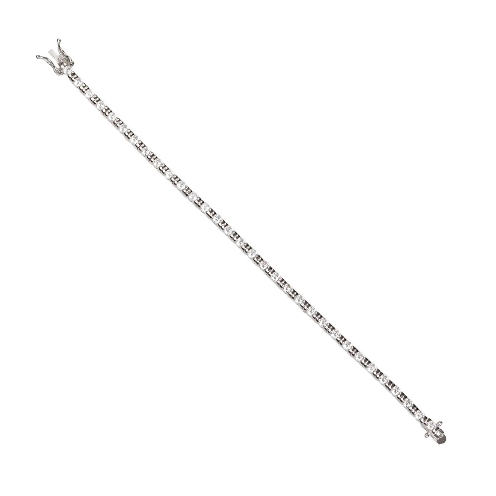 Silver riviere bracelet with zircons set. Bracelet with a classic and sophisticated design that adds sparkle and elegance to any look. This linear style bracelet features a continuous row of sparkling zirconias, secured with a discreet safety clasp for comfort and a perfect fit. Ideal for special occasions or to add a touch of glamour to your everyday.