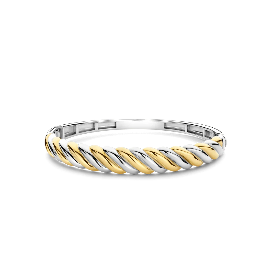 Verfijn je stijl met de TI SENTO armband 23078SY, een gedurfd en sculpturaal meesterwerk vervaardigd uit premium 925 sterling zilver. Het ontwerp bestaat uit een gedraaide combinatie van geelgoudgekleurde- en zilvergekleurde banden, die zelfvertrouwen en verfijning uitstralen, en maakt het de ultieme statement-accessoire. De dynamische en vloeiende silhoeët past prachtig bij zowel gedurfde als minimalistische outfits. Hypoallergeen en nikkelvrij, biedt deze armband zowel comfort als kwaliteit, met een luxueus gevoel voor de hele dag.

Deze spangband is in 3 maten verkrijgbaar.